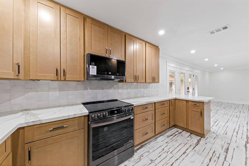The kitchen showcases an excellent use of space, featuring efficient layout and ample storage for all your culinary needs.