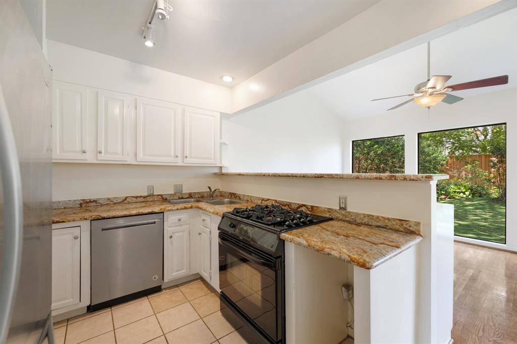 Granite countertops throughout the kitchen.