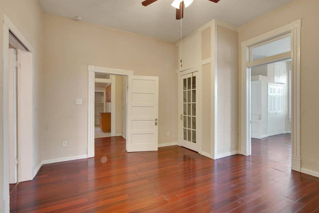 Bedroom 2- note the beautiful trim around the doors, solid wood entry doors, and ample closet space featured in this room.