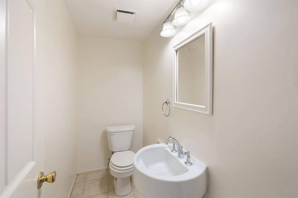 Powder bath is conveniently located right off of the living room.