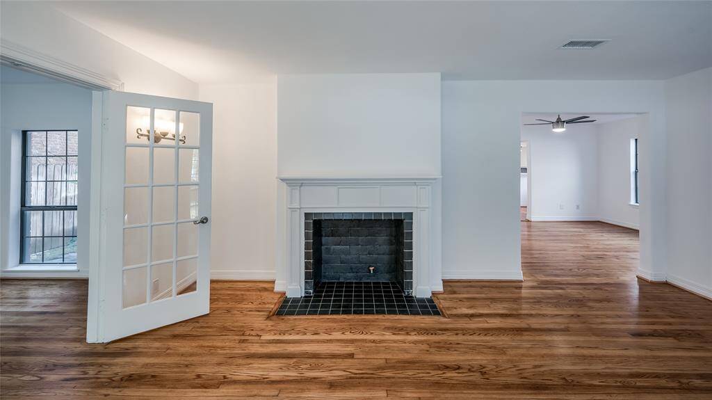 The living area opens to a large dining room which flows to the kitchen area. New ceiling fans throughout.