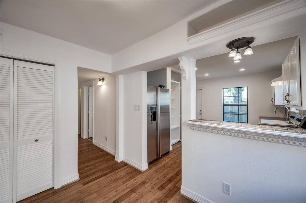 Between the kitchen and dining is a flexible space that could be a breakfast room, bar, scullery, or work space.