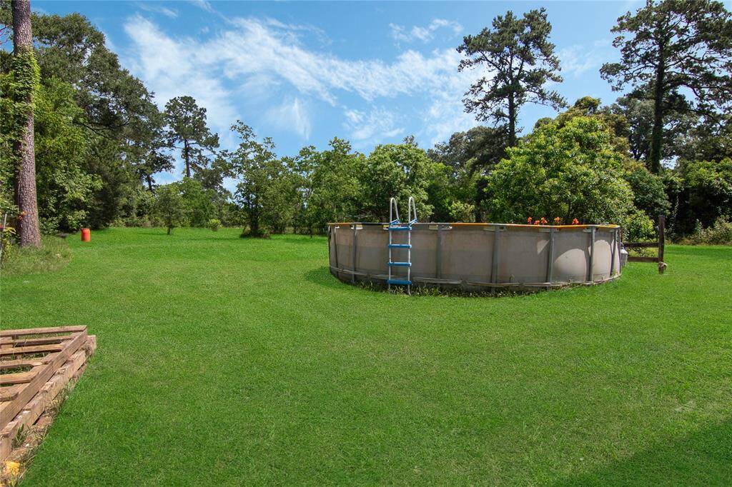 Huge backyard with above ground pool for the hot summer days!