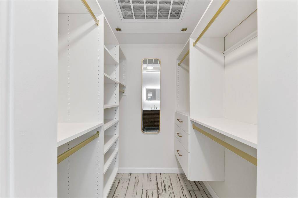 Generous walk-in closet provides ample storage and organization space, perfect for keeping everything in order