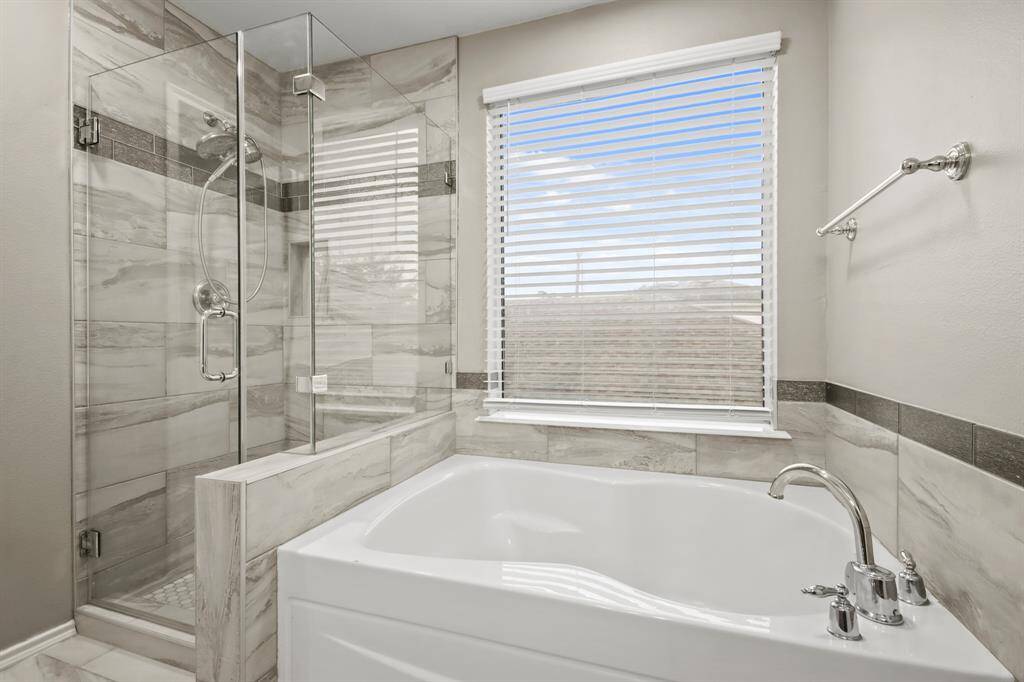 Separate shower and soaking tub.