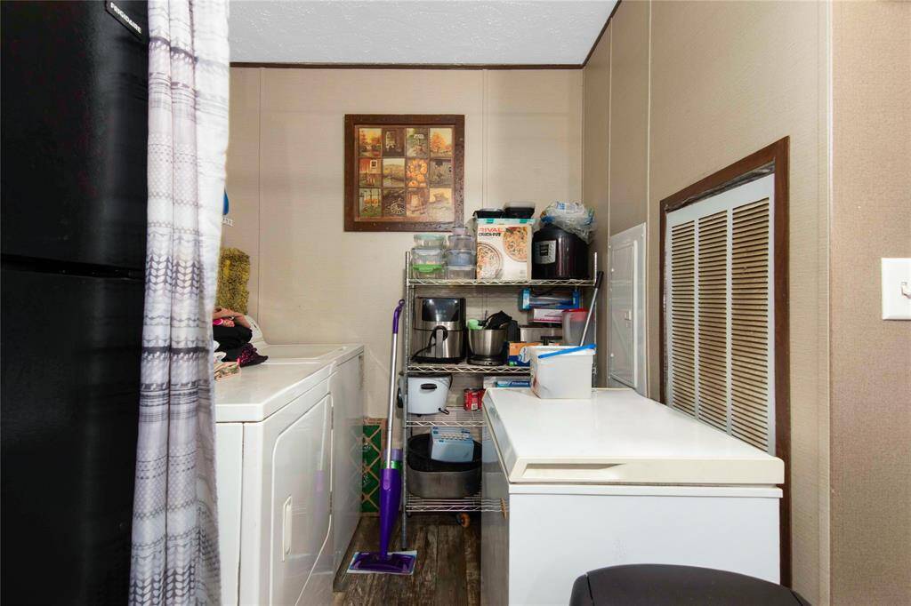 Wash Room with enough room for a deep freezer as shown