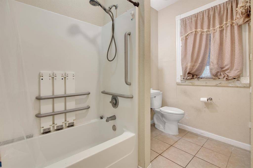 Bottom floor bathroom view of the shower/tub combo