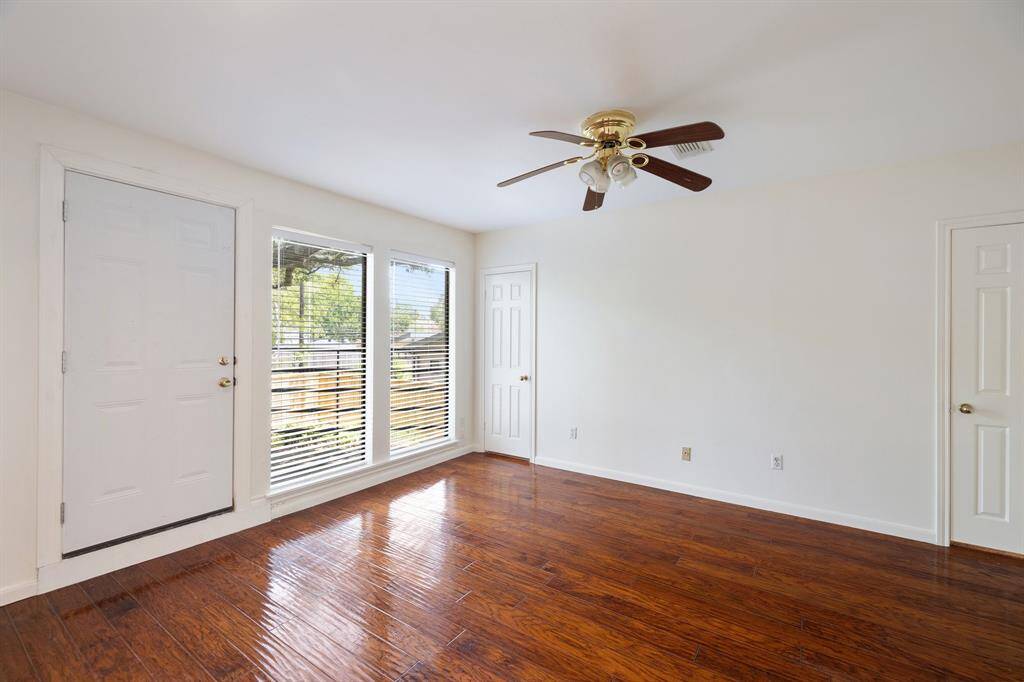 Primary bedroom offers dual closets, as well as a private balcony.