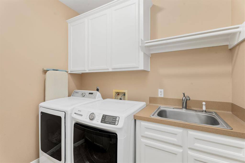 8'x8' laundry room has a sink! The washer & dryer can be included in the sale.