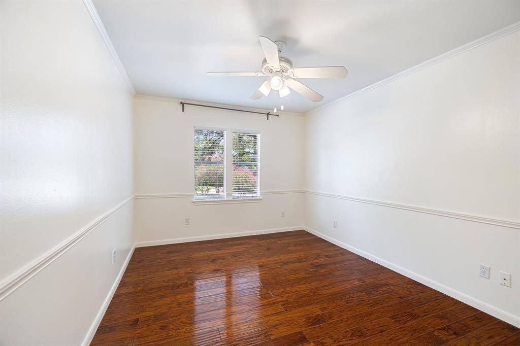 Hardwood floors throughout the secondary bedroom.