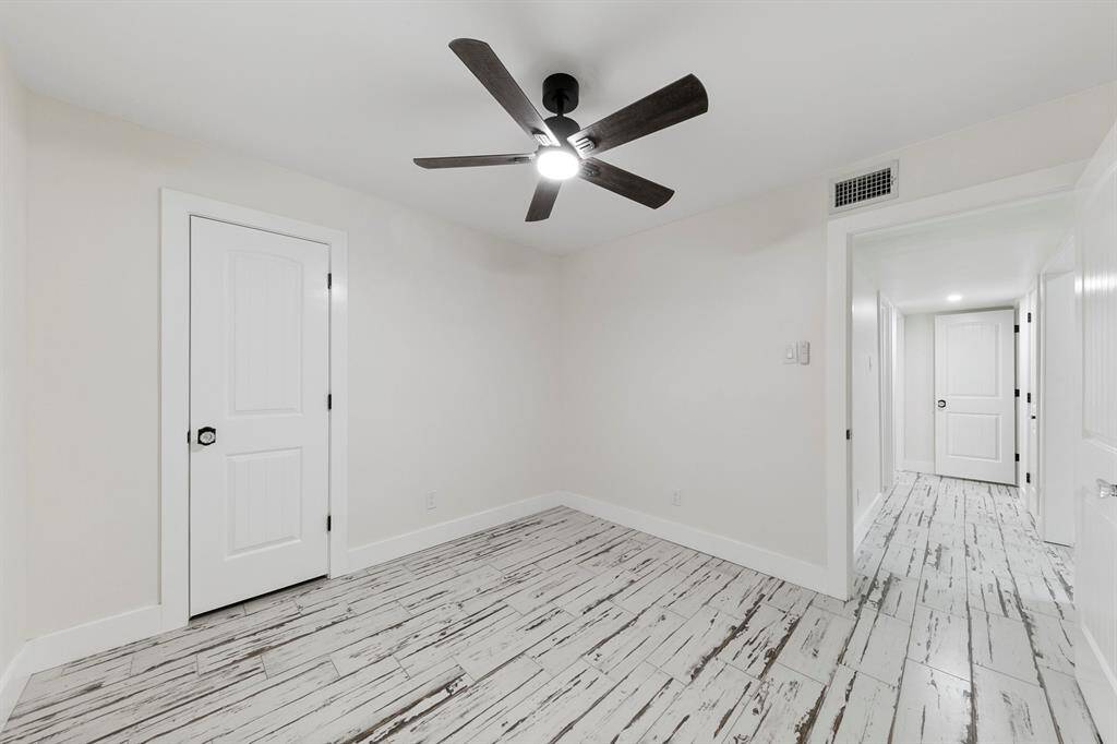 Versatile third bedroom, well-suited for a guest room, home office, or creative space, offering flexibility to meet your needs.
