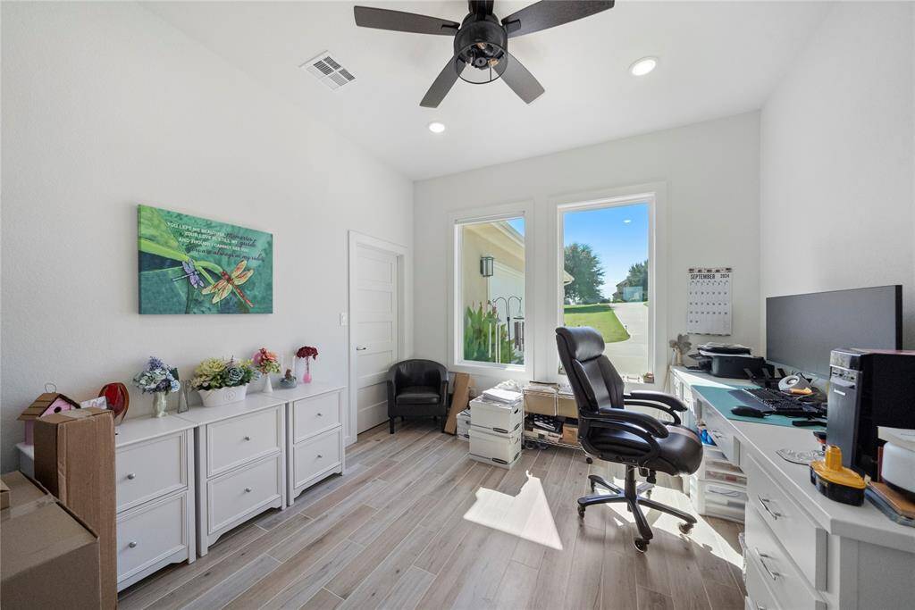 Office/study is located at the front of the home, with views to the front yard and drive.