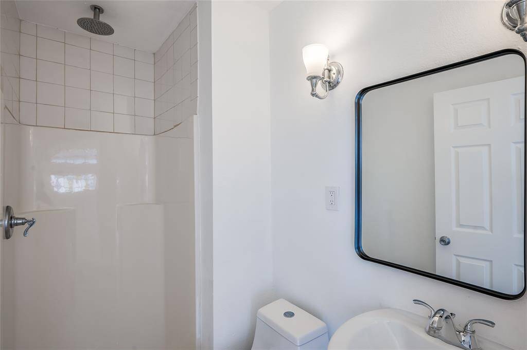 The full bath with shower is similar to the downstairs unit.