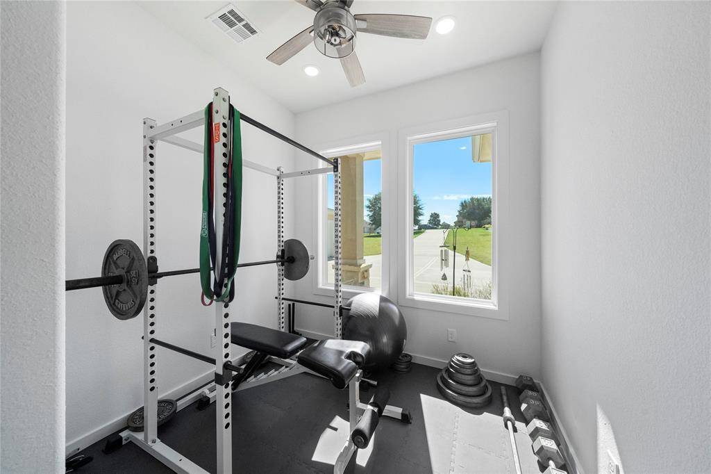 Extra room is currently being used as a workout room, but could also be a second office, craft room, library etc..