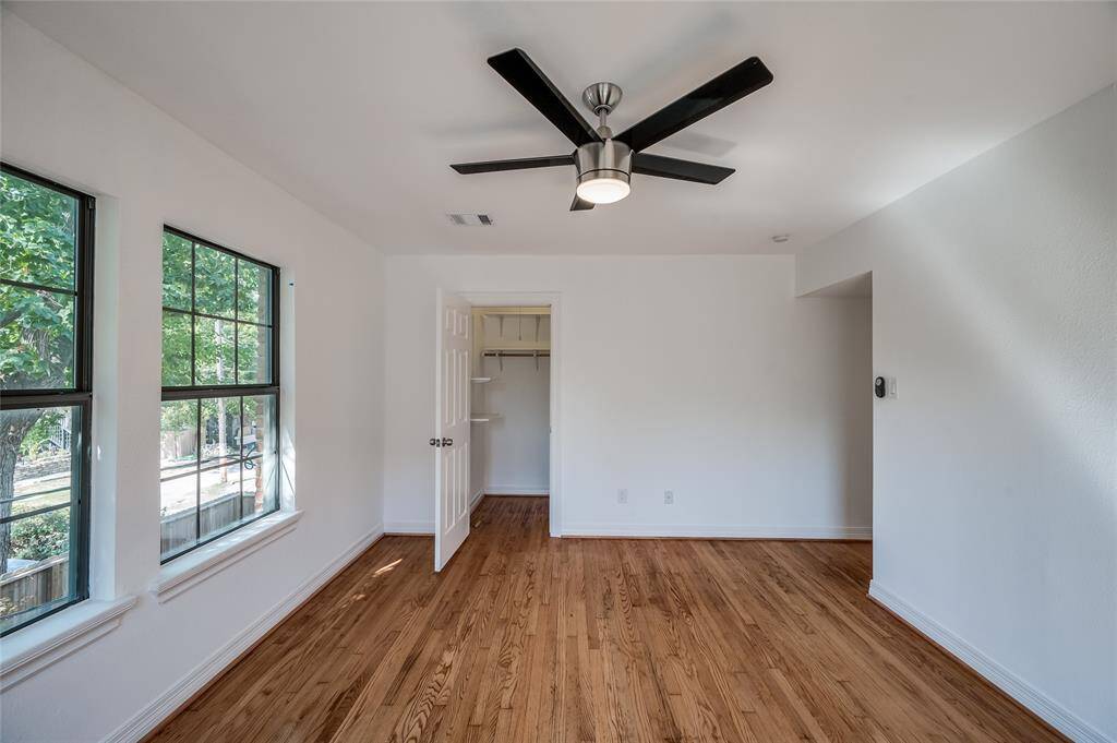Back bedroom has treetop back yard views and generous closet space.