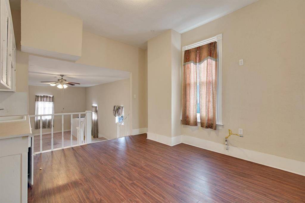 Another view of the second story kitchen. Note the wood flooring.