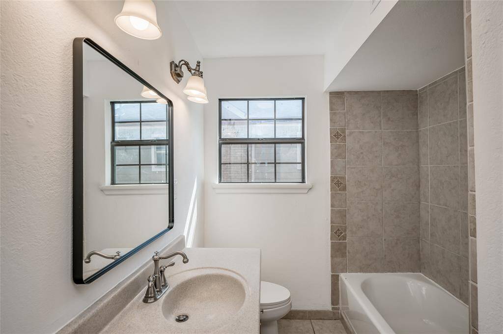 It is adjacent to a full bath with tub and shower.