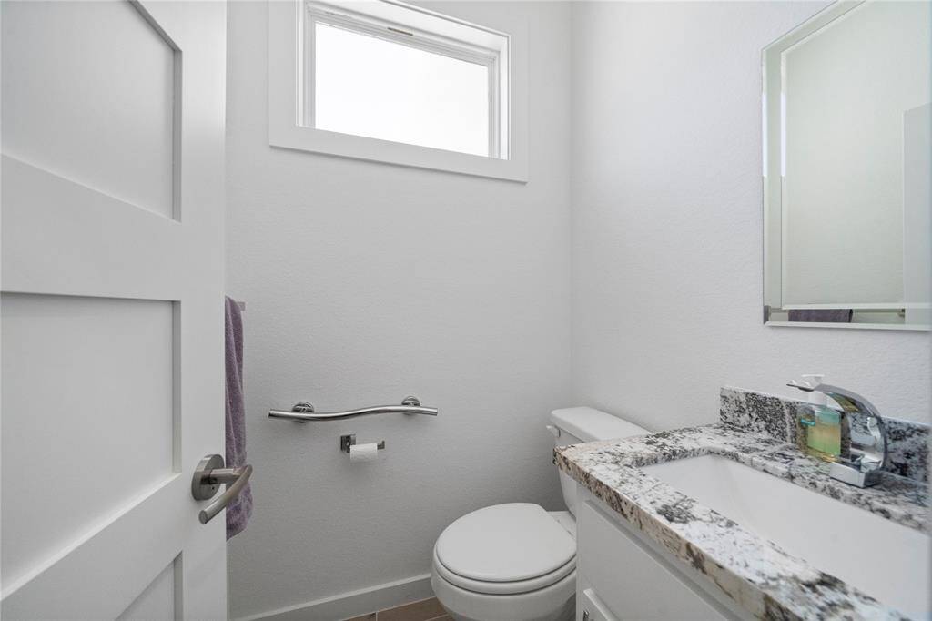 Half bath has the same counters and the rest of the home.