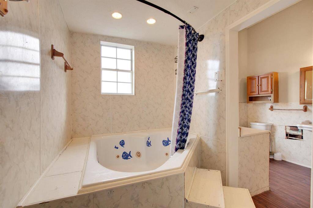 This bathroom is huge, and could easily be updated or re-configured. Picture a claw-foot tub and separate shower!