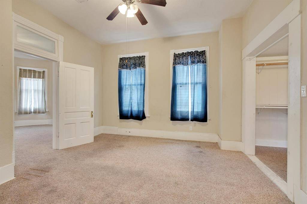 Another view of the secondary 2nd floor bedroom. Check out the sneakpeek of the massive walk-in closet space.