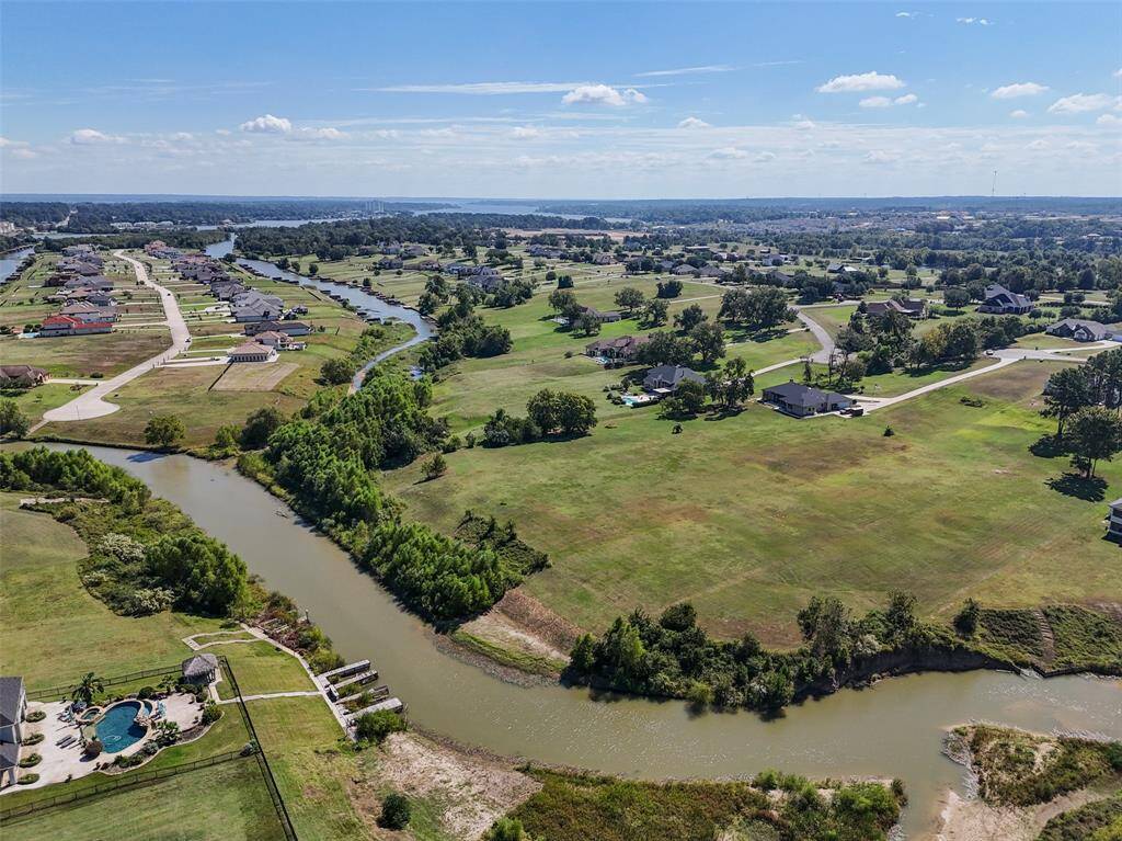Another aerial view of the back of the property where it meets the lake.