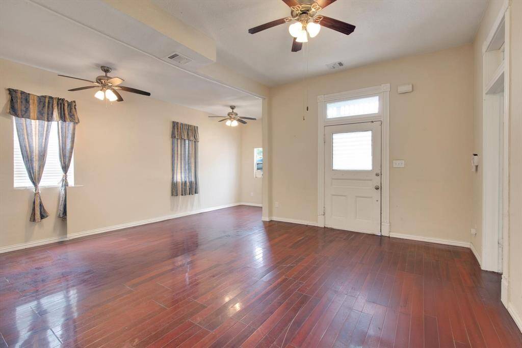 First floor front room. Looking towards the front entrance of the home.