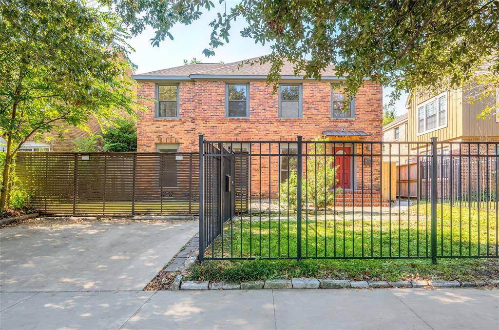 In the front, parking for at least 2 cars and a fenced yard with privacy screen.
