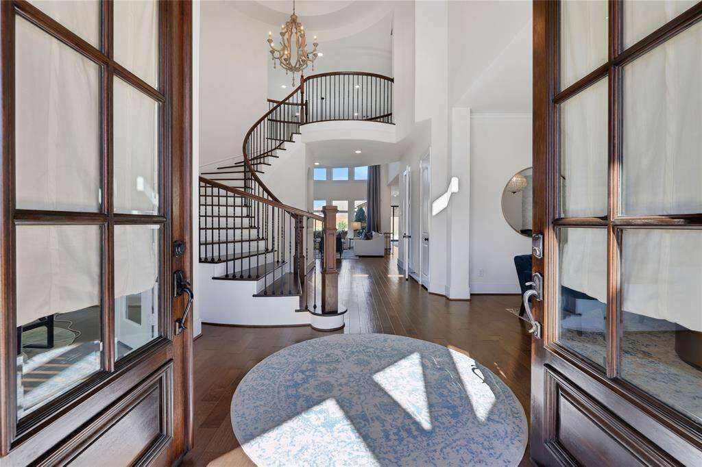 Welcome home - Impressive entry with high ceililngs, circular staircase & pretty wood floors