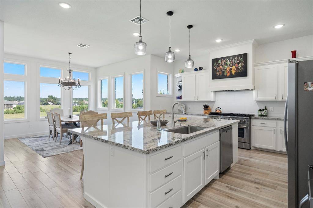 Another view of the kitchen looking toward the dining area. Kitchen also has great views out to the back of the property!
