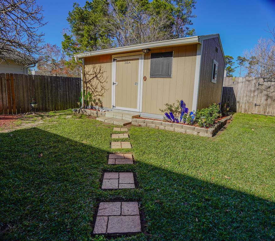 . 12x14 shop/storage on concrete, wired for 40 AMP, insulated, paneled, heat/AC.