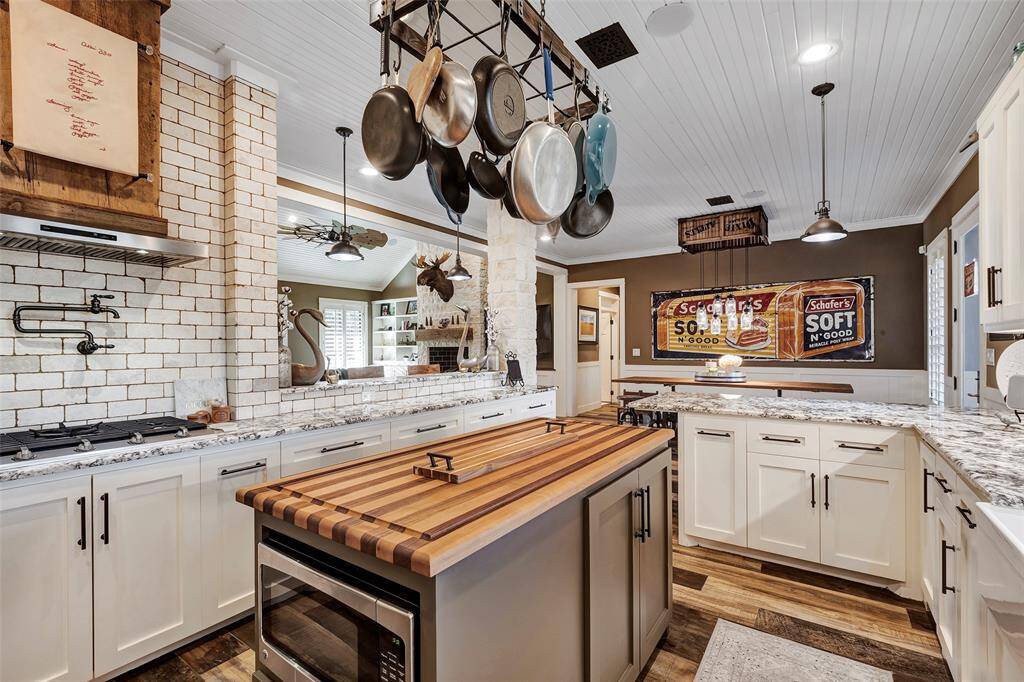 The island has an additional countertop that can easily be swapped out for a more formal furniture style look on special occasions.