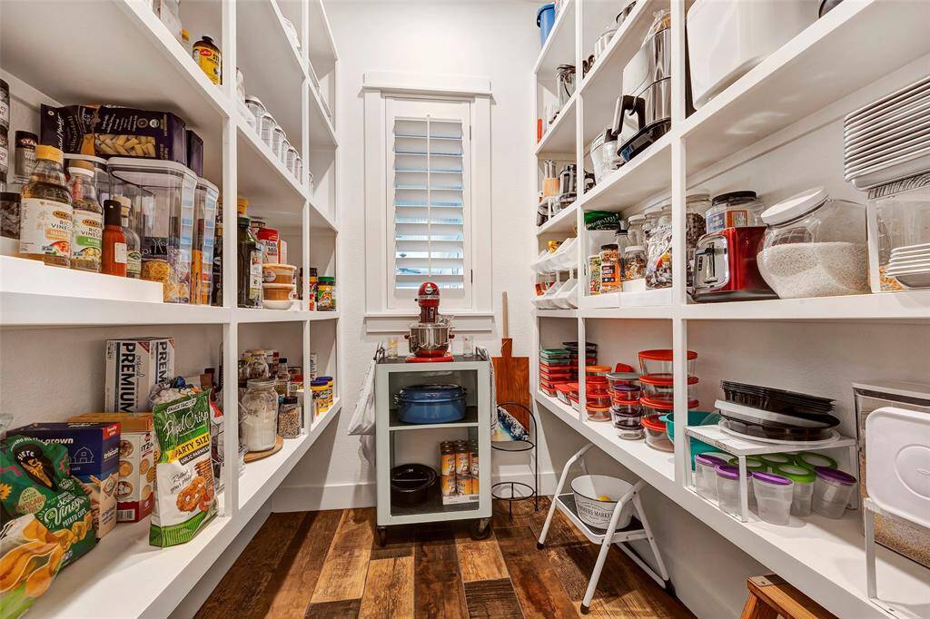 Oversized walk-in pantry easily houses your countertop appliances as well as your Costco haul