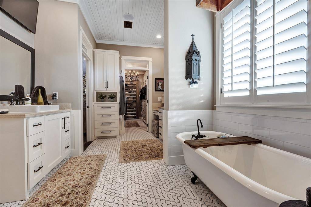 The primary bath has separate sinks, vanity area, lovely soaking tub and massive walk in shower