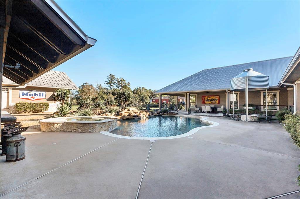 Your very own resort just outside your back door. With extended decking, covered grilling/bar area, custom silo covered firepit