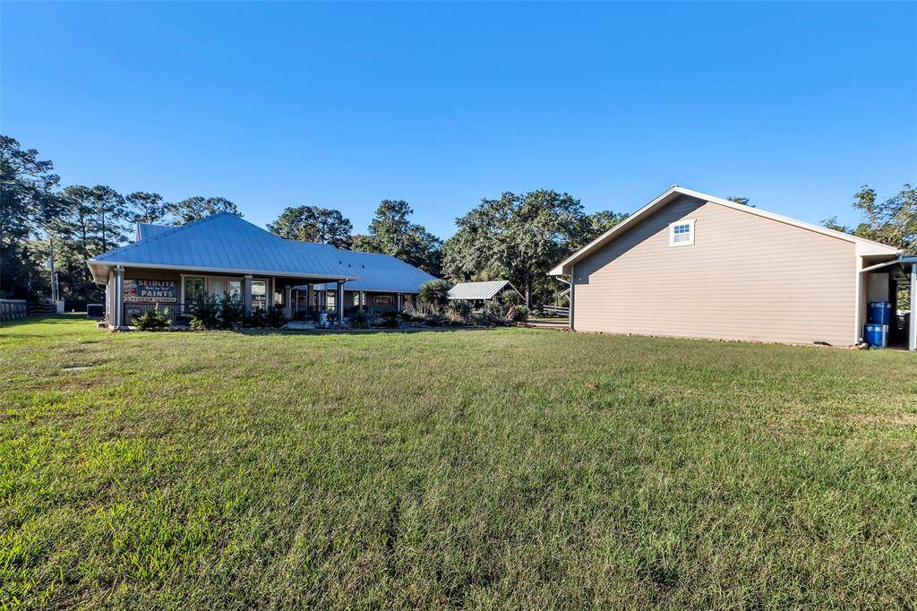 There is plenty of grassy area both in front of the home and behind the home ... waiting for your garden, animals or a fun game of football or catch ... a great space to add your private pickleball court