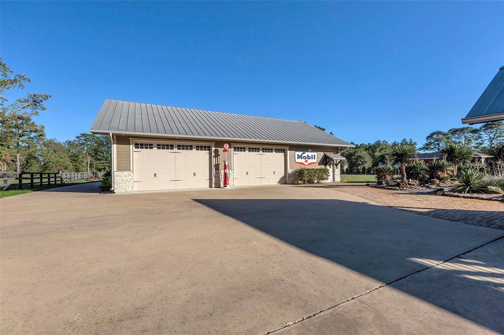 The workshop has 3 double door garage doors and private exterior door entrance