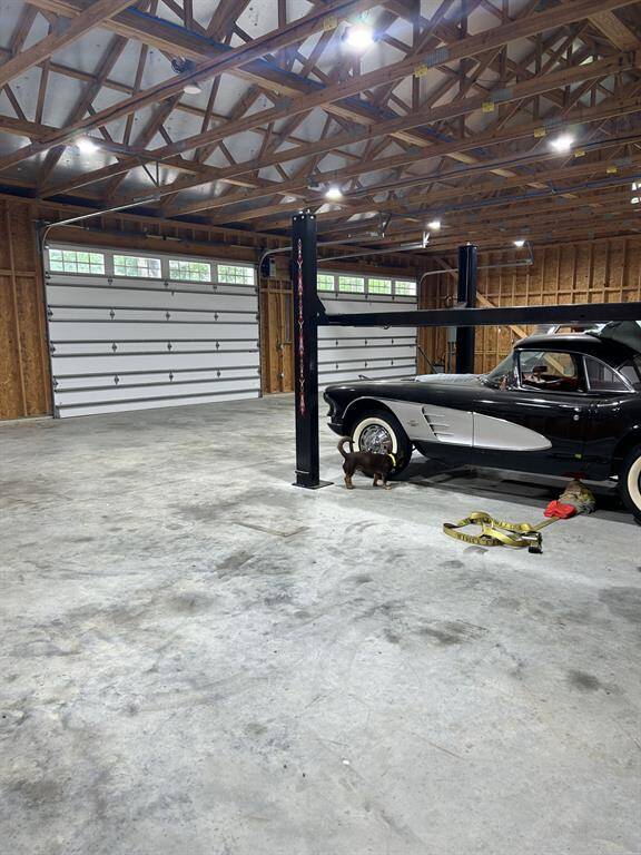 There are multiple double car garage doors on one side of the shop ....