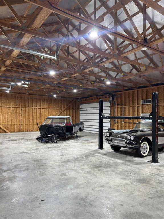as well as double garage door on the back side of the shop