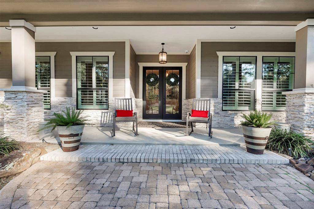 A fabulous covered front porch adds a sophisticated design element to the elevation and offers just one of many areas to relax and enjoy the property