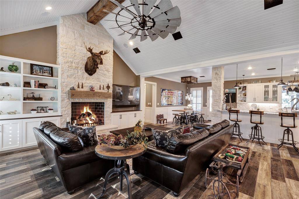 The open concept living space is both elegant and warm, a serene space to relax and entertain