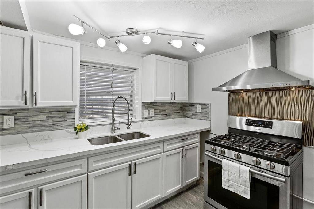 Downstairs Kitchen is Light, Bright, and modern! QUARTZ counters, stainless appliances, this is one to not miss!