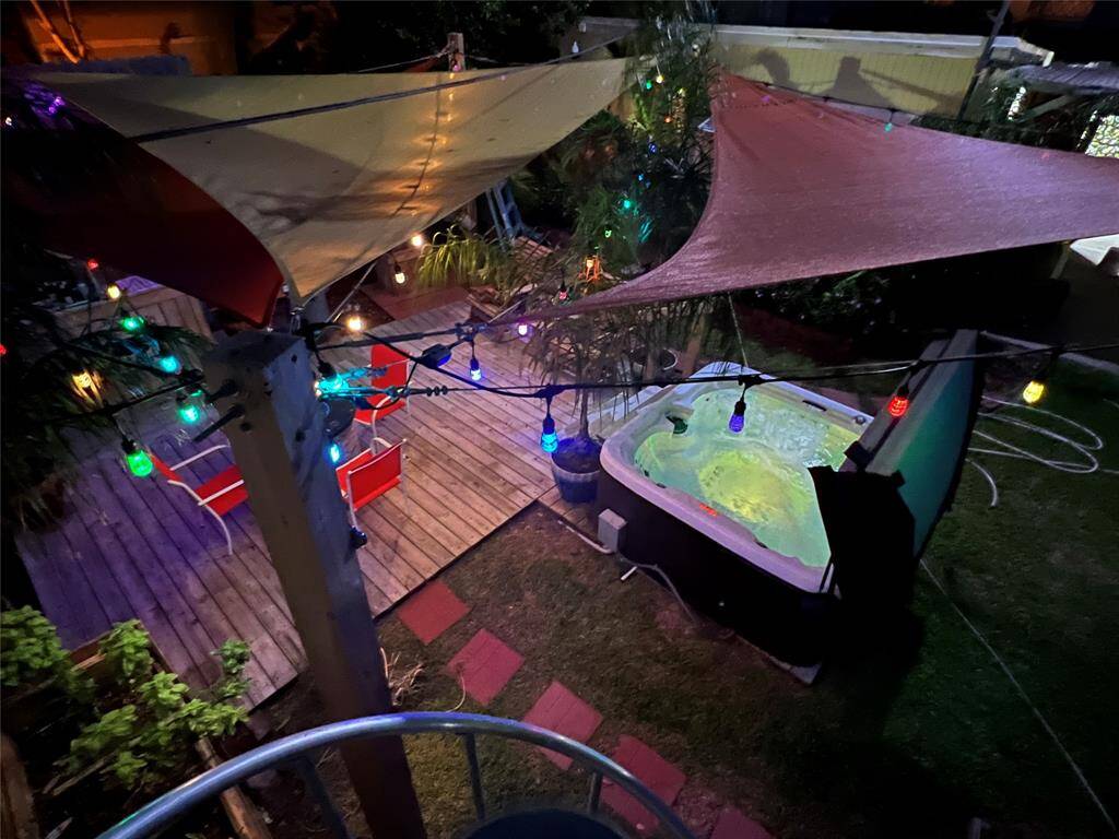 Wonderful hot tub, lush landscaping, deck, fire pit, sail shades and ambient lighting! Welcome to your oasis!