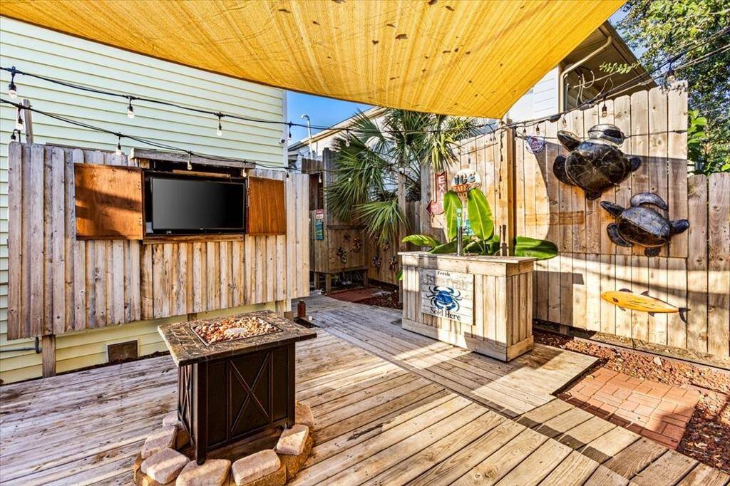Set the mood with the fire pit, string lights, and gather around!