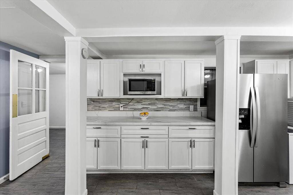 Downstairs Kitchen with great storage, and bonus deep freezer!