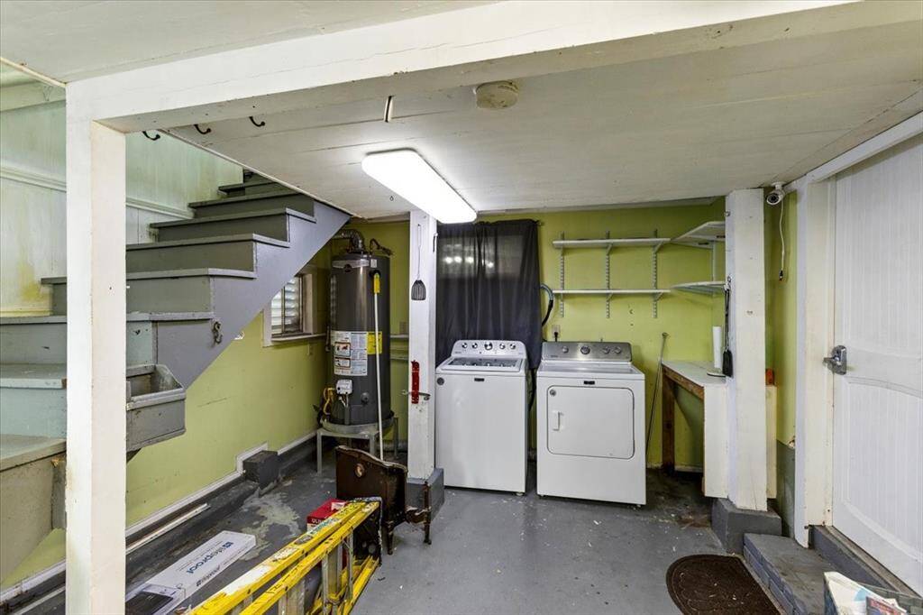 Utility room and posterior interior stairs