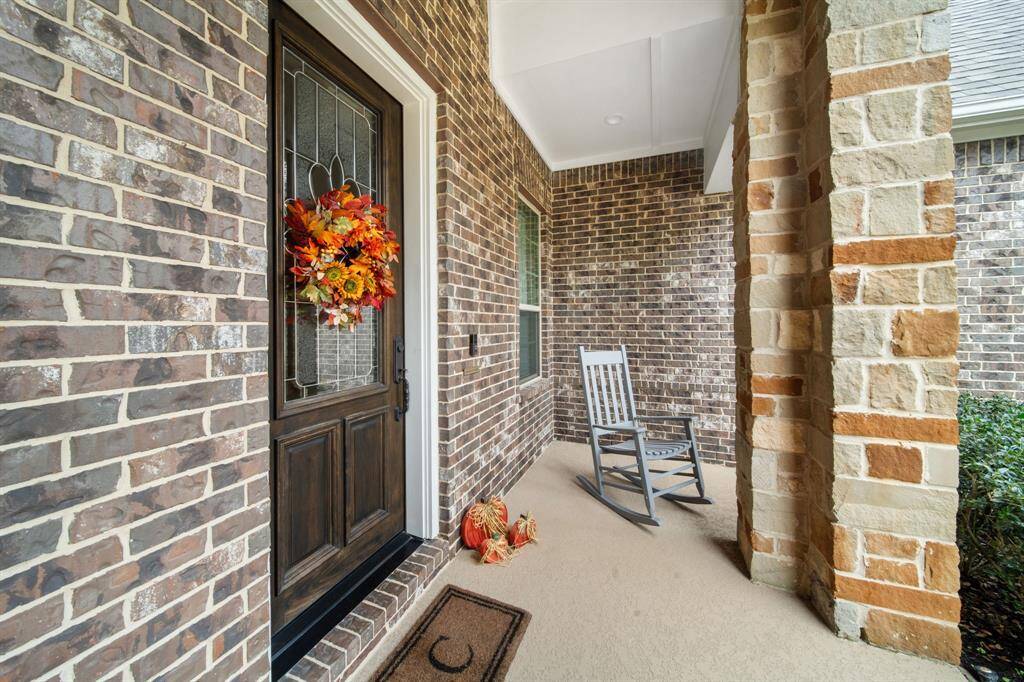 Step into charm and comfort on this inviting front porch.