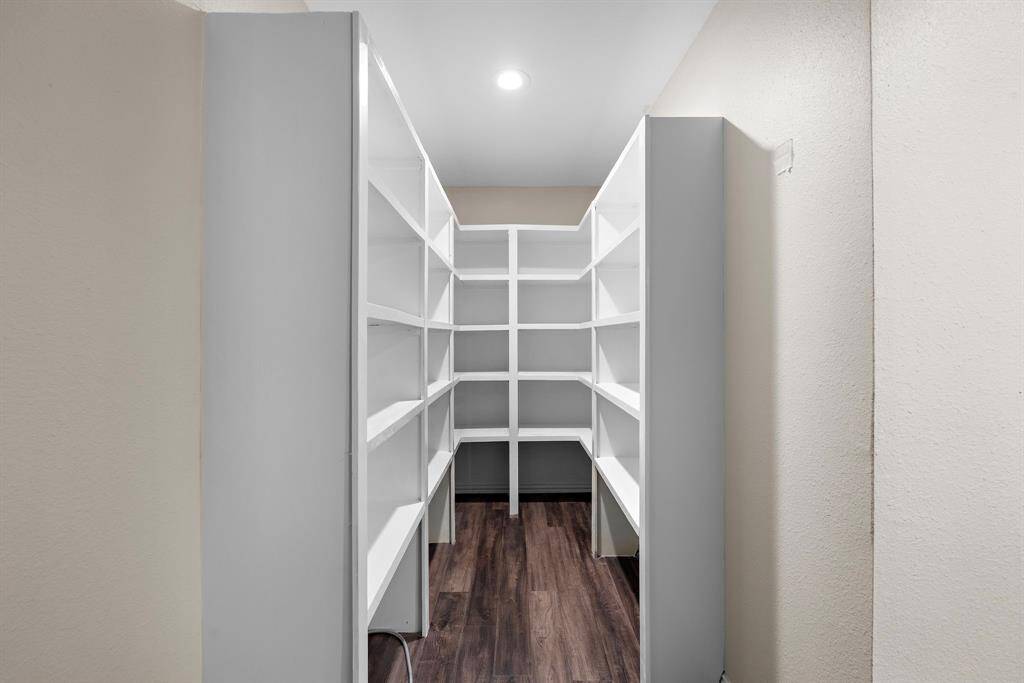 Walk-in pantry located off of the kitchen.