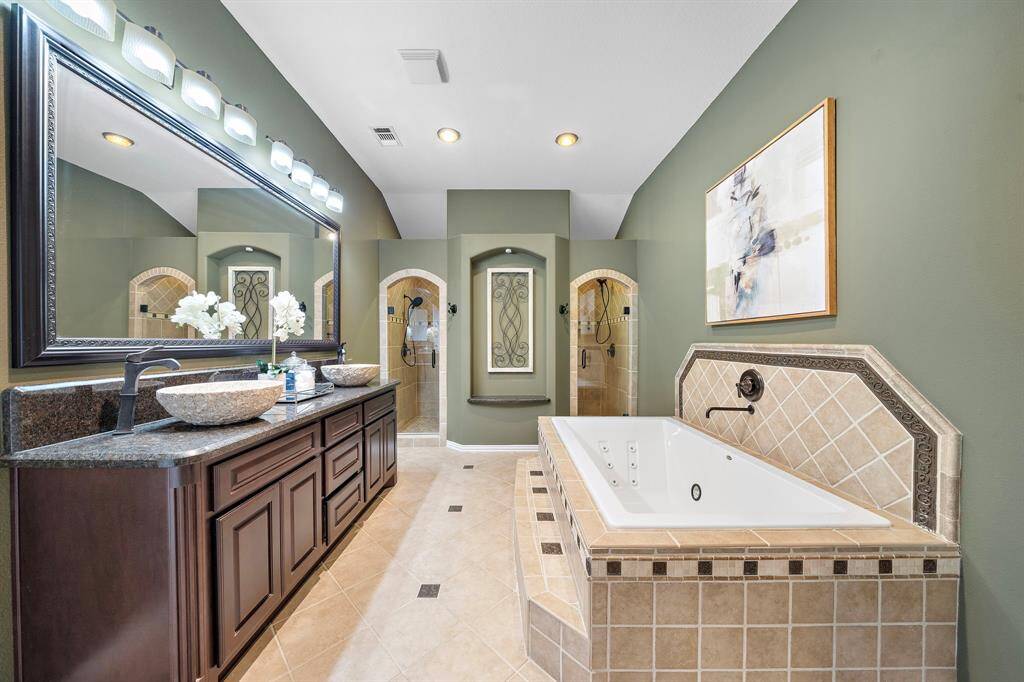Primary bathroom features double sinks.