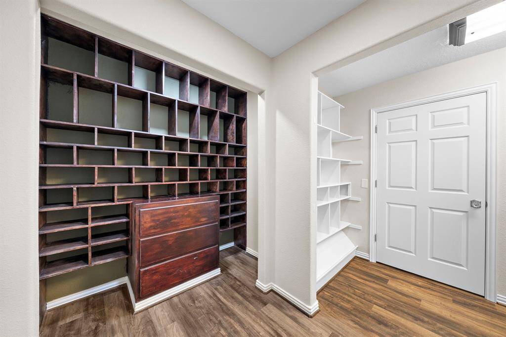 Storage area located off the hallway that leads to the primary bedroom.