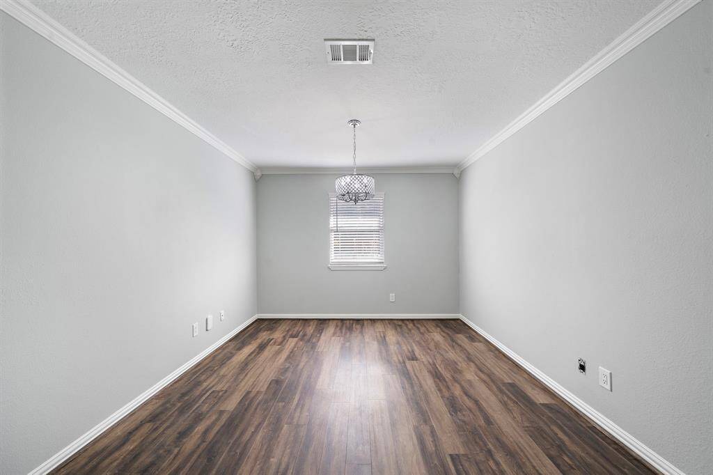 Home office featuring double french doors and a chandelier.  The seller will convert this room into a 3rd bedroom if desired.